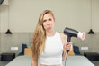 © kues1 - feeling sad and whiney with an unhappy look and crying. hair dryer concept
