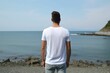 white plain tshirt, from the back, sea background