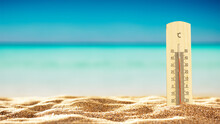 Summer Thermometer On The Beach And Empty Space For Your Decoration.