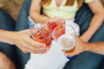 Wall Mural - Friends Celebrating toast with fresh cocktails on a summer terrace.