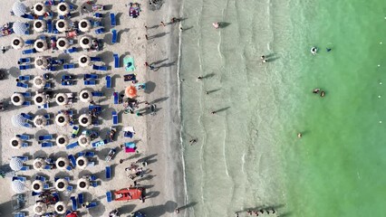 Wall Mural - aerial view on beach, people and umbrellas. vacation and adventure. europe, mediterranean sea. top v