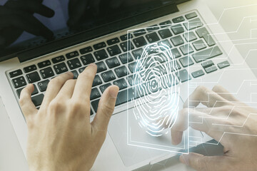 Aufkleber - Double exposure of abstract creative fingerprint hologram with hands typing on laptop on background, protection of personal information concept