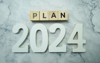 Plan 2024 alphabet letter on marble background