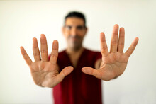 Blurred Ethnic Adult Man Showing Open Fingers