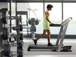 © Ljupco Smokovski - African american guy on a treadmill at a gym