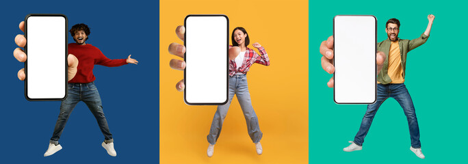 Happy multiethnic millennials jumping with smartphones in hands