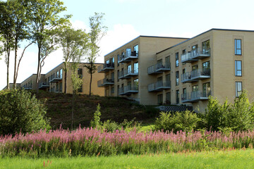 newly built house for senior citizens in yellow brick with balconies. rent apartment. convenient loc