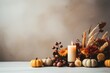 © tilialucida - A candle surrounded by fall flowers and pumpkins. Autumn, Thanksgiving decor. Copy-space, place for text.