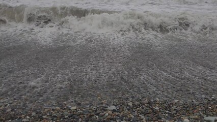 Poster - sea with waves in cloudy weather.