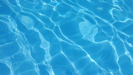Poster - Blue water in the pool with sun glare.