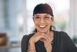 © HockleyMedia/peopleimages.com - This is the smile of success. Cropped portrait of an attractive young businesswoman sitting alone in her office with her hand on her chin.