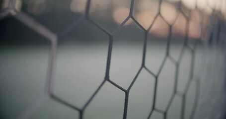 Soccer Net Macro Shot with Early Morning Sunrise