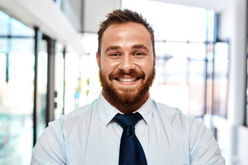 Aufkleber - Doing business with a big smile on his face. Portrait of a young businessman standing in an office.