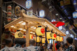 Ofunehoko float and people passing Nishiki Ichiba market for Hiyori Kagura during Gion matsuri festival in Kyoto, Japan