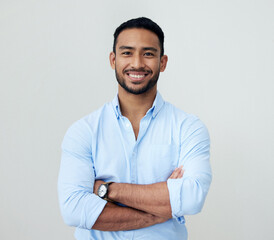 Poster - Economist, portrait and business man with arms crossed in studio isolated on a white background. Face, confidence and happy Asian male professional, entrepreneur or analyst from Singapore with mockup