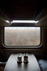 Tea party on the train. Traditional Russian glasses on railway trains