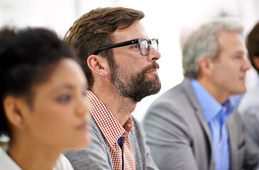 Aufkleber - project debriefing. shot of a group of dedicated business professionals sitting in a row.