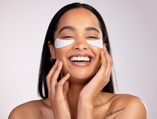 happy woman, portrait smile and eye mask in skincare, collagen or dermatology against a grey studio 