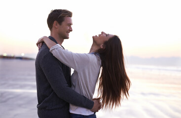 Theres nothing like young love. A young couple enjoying a romantic moment together at the beach.