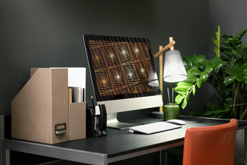 Cozy workspace with computer on metal desk at home