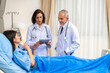 © Art_Photo - Senior man doctor wearing uniform with stethoscope help discussing and consulting talk to sick woman patient checkup information, support, care, diseases, treatment in hospital.healthcare