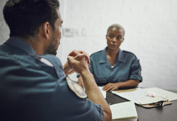 Poster - People, police and team in meeting for crime report, documents or case discussion at the precinct. Man and woman, law enforcement or officers working together on investigation or paperwork at station