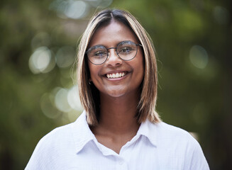 Wall Mural - Portrait, smile and glasses with a woman in nature, outdoor on a green background for travel or freedom. Face, eyewear and a happy young female person standing in a park for vision or eyesight