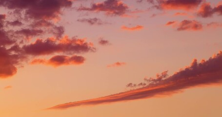 Wall Mural - dramatic sunset sky with fluffy color clouds 4k video, time lapse sunrise cloudscape