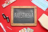 Fototapeta  - Chalkboard with word ANESTHESIA and medical supplies on red background