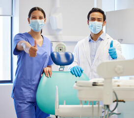 Wall Mural - Dentist team, face mask and thumbs up portrait for.medical industry and teamwork. Assistant woman and asian man or healthcare staff together for dental care, oral health and wellness at practice
