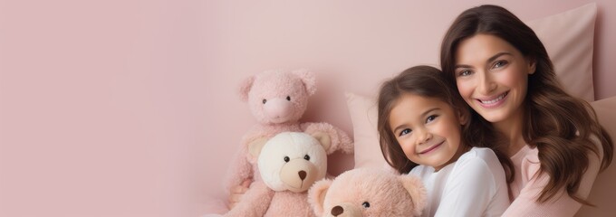 Portrait of a Caucasian girl and mother on pink rose gold beige with bear doll background. World Mother's Day concept