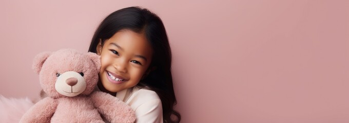 Wall Mural - Portrait of Asian girl playing with toy bear doll