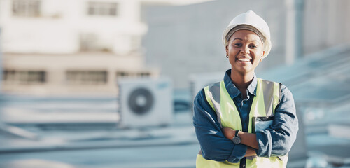 Poster - Woman, construction worker and portrait with a smile for engineering and building renovation job. Arms crossed, happy and African female employee on a industrial site outdoor for builder project