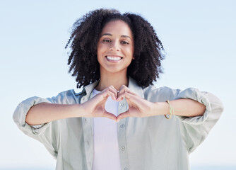 Canvas Print - Woman, heart hands and portrait on beach, happiness and support with emoji, travel and wellness with health outdoor. Adventure, love sign and female person with smile, peace and calm with care