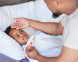 © Talia Mdlungu/peopleimages.com - Father, thermometer and sick child in bed with a fever and hand of dad on head to check temperature. Black boy kid and a man together in a bedroom for medical risk, health test and virus problem