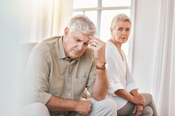 Canvas Print - Senior couple, divorce and headache in conflict, fight or argument on the living room sofa at home. Elderly woman and frustrated man in depression, cheating affair or toxic relationship in the house