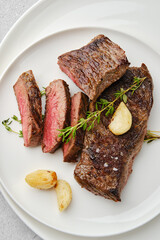 Wall Mural - Top view of beef steak medium rare on a plate