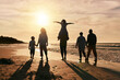 © Daniels C/peopleimages.com - Silhouette, family is walking on beach and back view with ocean waves, sunset and bonding in nature. Generations, people outdoor and tropical holiday, freedom and travel with trust and love in Mexico