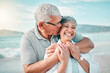 © Daniels C/peopleimages.com - Happy, kiss or old couple laughing on beach with love, care or support on summer vacation in nature. Retirement, mature man hugging or funny senior woman at sea or ocean to travel on holiday together