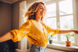 © VisualProduction - Positive white woman dancing at home. Happiness and well being concept.