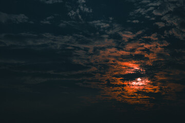 Wall Mural - abstract photo of dramatic clouds on the sunset or evening time.