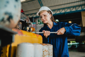 Canvas Print - Professional engineer women worker or mechanical foreman working to maintenance and check in factory warehouse, engineering women training workshop for factory operators, Business factory industry.