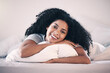© Lategan/peopleimages.com - Happy, smile and portrait of a woman in bed relaxing in the morning on a weekend at her home. Happiness, rest and calm young female person from Colombia lying in the bedroom of her modern apartment.