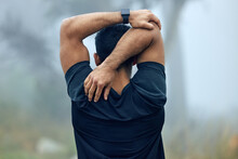 Fitness, Back And Man Stretching Arms For Exercise, Workout Or Training In The Nature Outdoors. Rear View Of Fit And Active Male Person Or Runner In Warm Up Stretch For Running Or Cardio Exercising