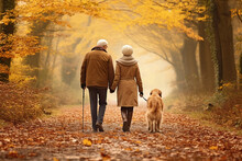 Senior Couple With A Dog Walks On Autumn Park. AI Generated