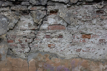 Wall Mural - Old dilapidated stone wall of the building