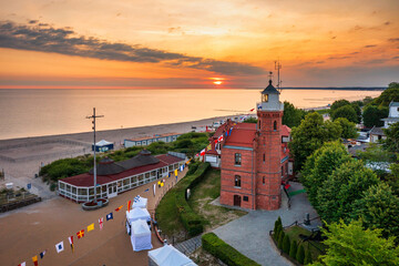 Canvas Print - Lighthouse in Ustka by the Baltic Sea at sunrise, Poland.