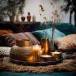 © Daria Minaeva - Warm cozy home interior with burning candles, afternoon room decoration, creative decor arrangement