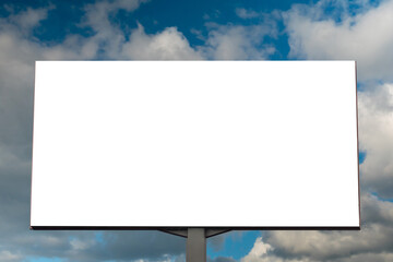 Wall Mural - front view: blank white billboard or large display against blue sky with white clouds - mock up. con