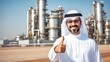 Arab man in keffiyeh against the background of an oil refinery with a joyful expression on his face